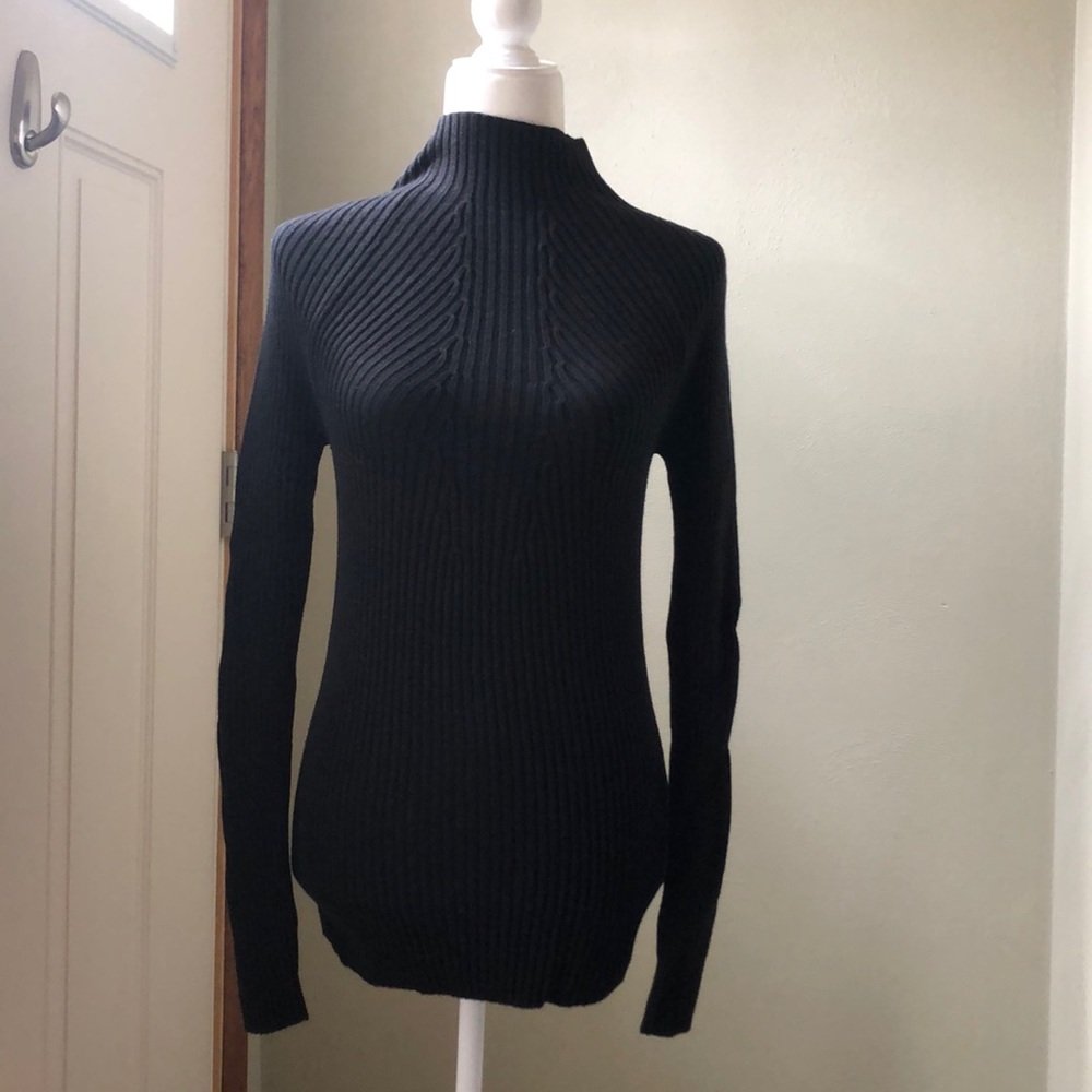 Black form fitting mock neck sweater